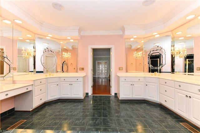 bathroom with crown molding and vanity