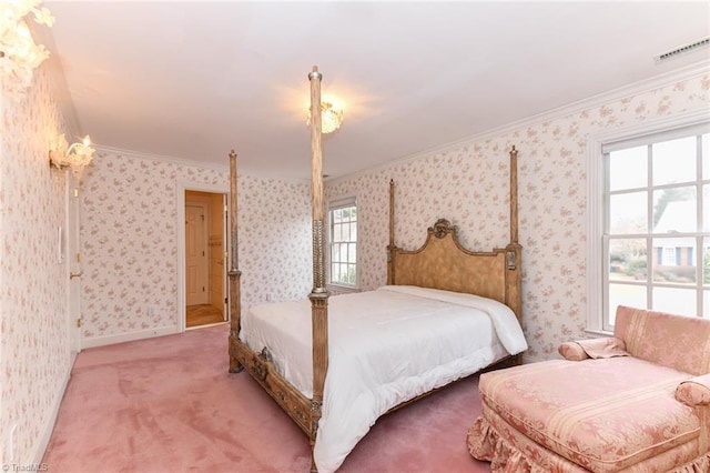 carpeted bedroom featuring crown molding