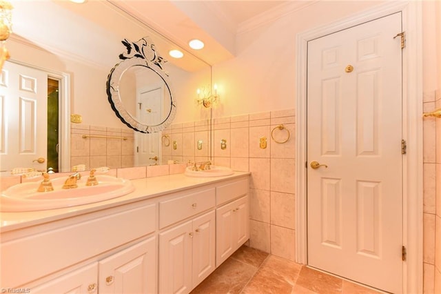 bathroom with ornamental molding, tile walls, and vanity