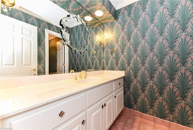 bathroom featuring tile patterned flooring, crown molding, and vanity