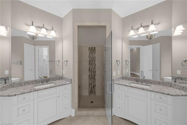 bathroom featuring a stall shower, a sink, and crown molding