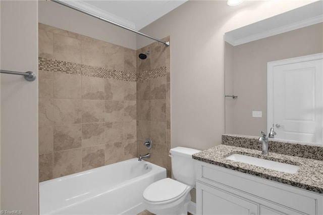 bathroom featuring toilet, vanity, crown molding, and shower / bathing tub combination