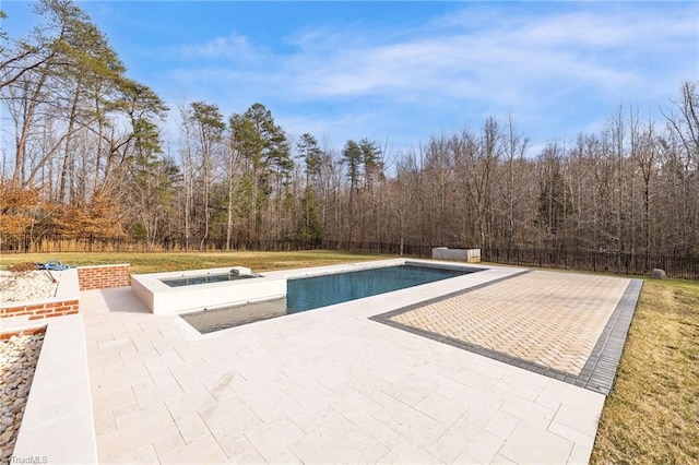 view of pool featuring a patio area, fence, a fenced in pool, and an in ground hot tub