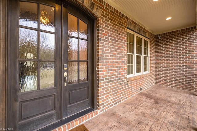 doorway to property with french doors and brick siding