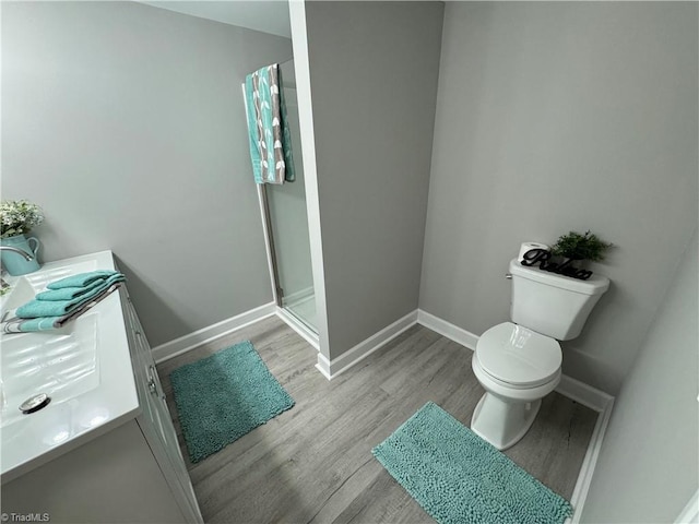 5515 Bethania Rd, Pfafftown, NC 27040 - bathroom featuring a shower stall, wood finished floors, and vanity
