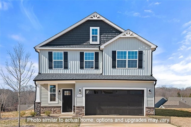 craftsman inspired home featuring an attached garage, stone siding, driveway, and board and batten siding