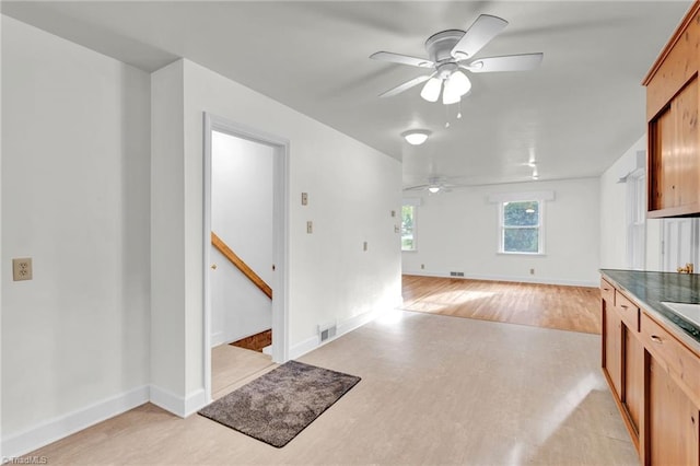 kitchen featuring light hardwood / wood-style flooring and ceiling fan