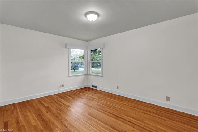 spare room with light wood-type flooring