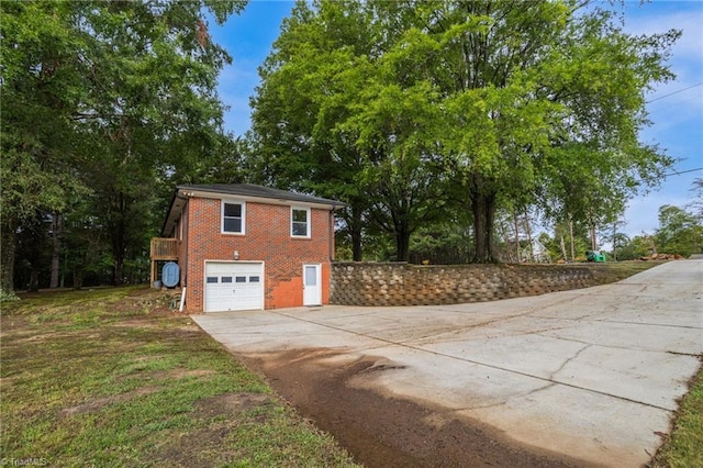 view of side of home with a garage