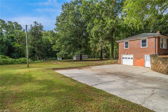 view of yard with a garage