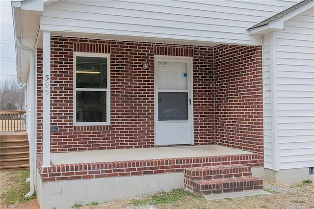 entrance to property with brick siding