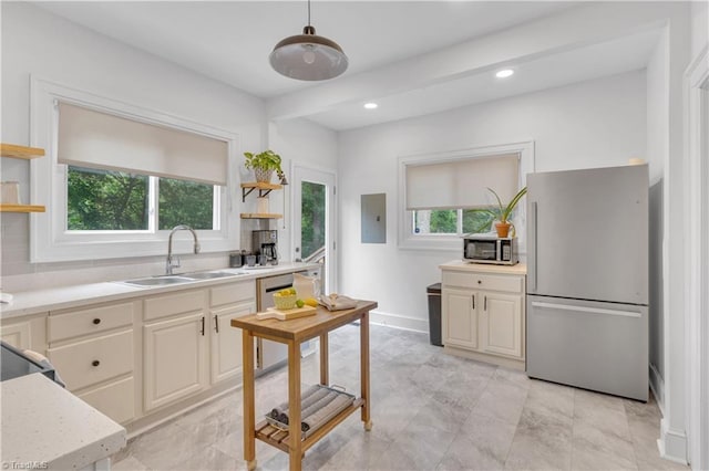 1501 Wiltshire St, High Point, NC 27265 - kitchen featuring appliances with stainless steel finishes, open shelves, a sink, light countertops, and recessed lighting
