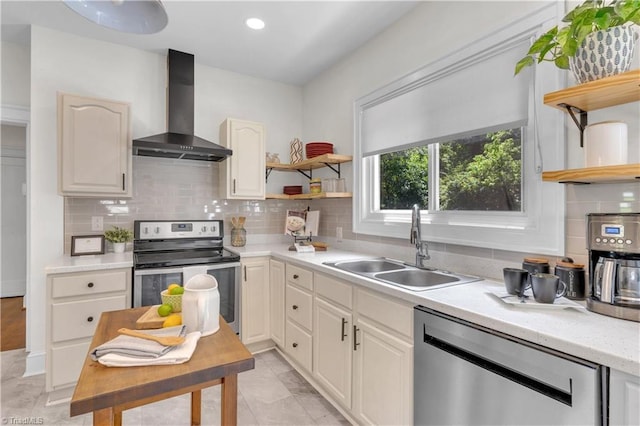 1501 Wiltshire St, High Point, NC 27265 - kitchen featuring open shelves, wall chimney range hood, stainless steel appliances, a sink, and recessed lighting