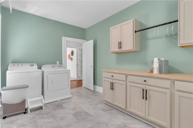 1501 Wiltshire St, High Point, NC 27265 - laundry area with washer and clothes dryer, cabinet space, and baseboards