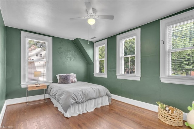 1501 Wiltshire St, High Point, NC 27265 - bedroom featuring wood finished floors, baseboards, and multiple windows