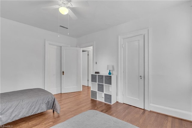 1501 Wiltshire St, High Point, NC 27265 - bedroom with wood finished floors, baseboards, and a ceiling fan