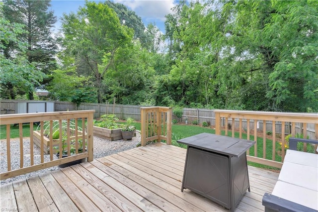 1501 Wiltshire St, High Point, NC 27265 - wooden terrace with a vegetable garden, a fenced backyard, and view of scattered trees