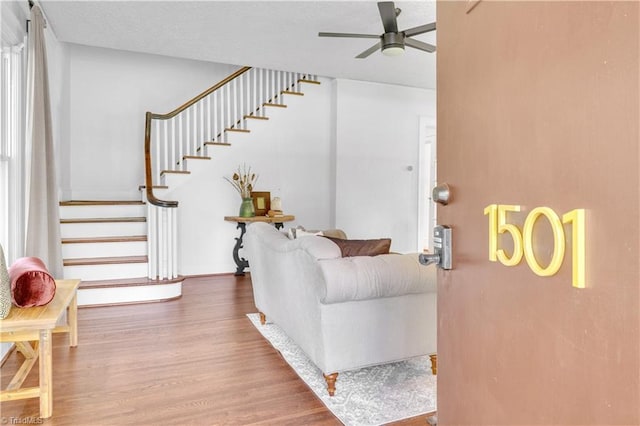 1501 Wiltshire St, High Point, NC 27265 - living room featuring ceiling fan, wood finished floors, and stairway