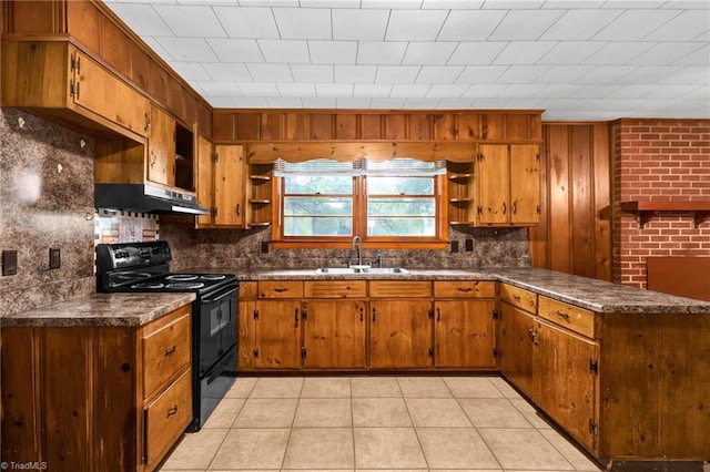 kitchen with backsplash, black range with electric cooktop, light tile patterned floors, and sink