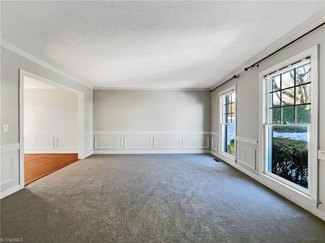 carpeted spare room with ornamental molding