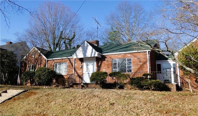 view of front of house featuring brick siding