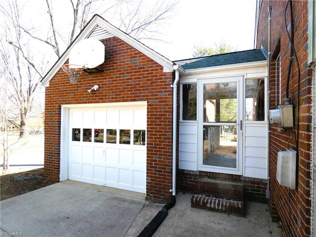 garage with concrete driveway