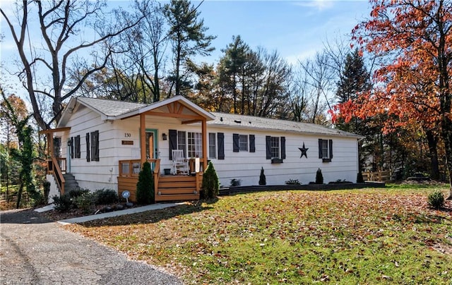 ranch-style home with covered porch