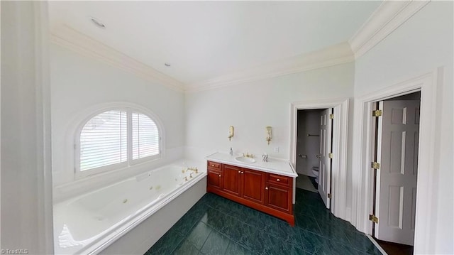 bathroom featuring ornamental molding, toilet, a tub with jets, and vanity