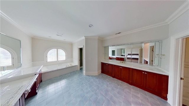 bathroom featuring a bath, vanity, ornamental molding, and visible vents