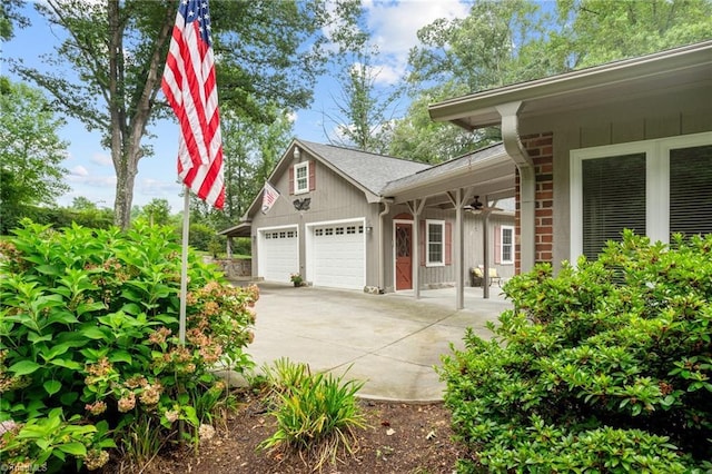 134 English Primrose Ln, Dobson, NC 27017 - view of home's exterior featuring ceiling fan, driveway, and an attached garage