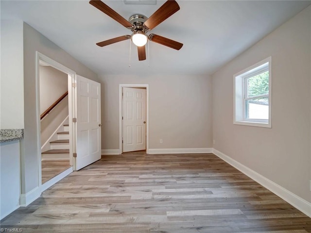 interior space with light hardwood / wood-style flooring and ceiling fan