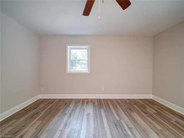 unfurnished room with ceiling fan and light hardwood / wood-style flooring