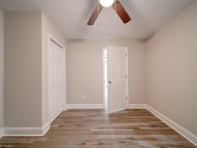 interior space with a closet, light wood-type flooring, and ceiling fan