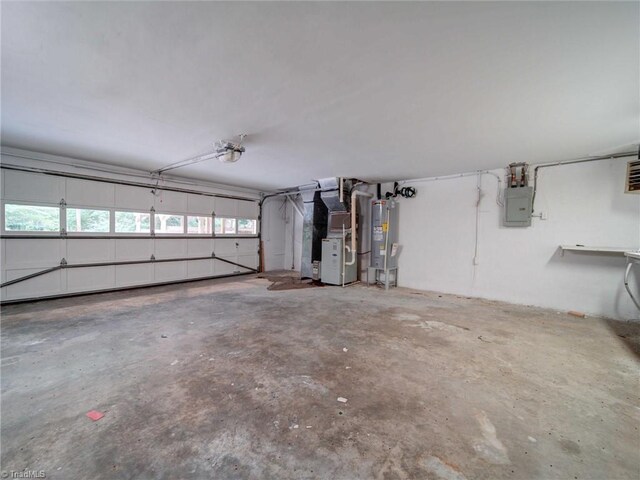 garage with electric water heater, heating unit, and electric panel