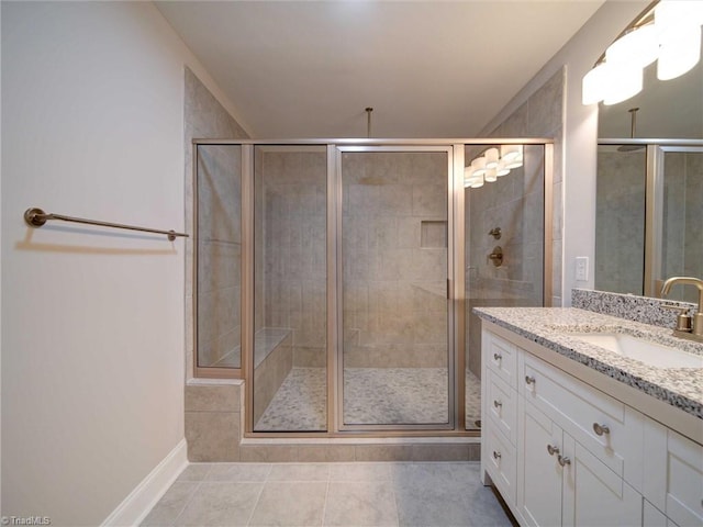 bathroom featuring vanity, tile patterned floors, and an enclosed shower