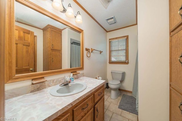 bathroom with ornamental molding, toilet, vanity, and tile patterned flooring