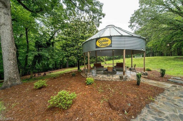 view of green lawn featuring a gazebo