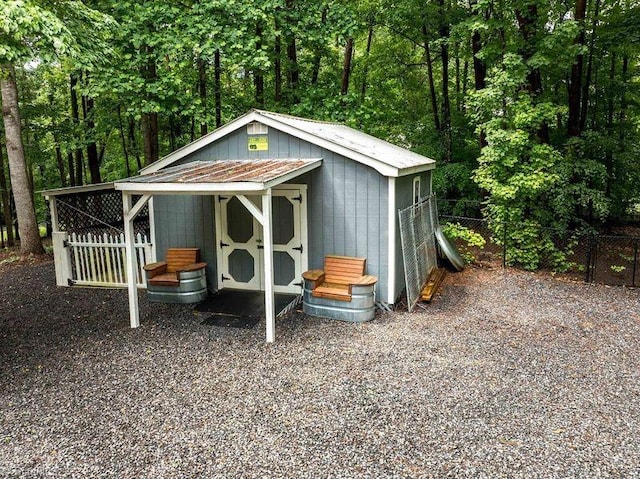 view of shed with fence
