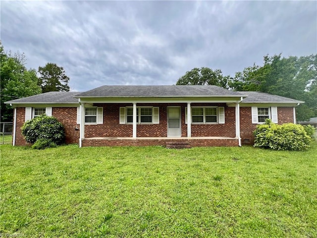 5261 Windemere Cir, Trinity, NC 27370 - ranch-style home with a front yard, brick siding, and covered porch