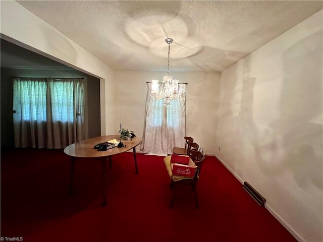 5261 Windemere Cir, Trinity, NC 27370 - carpeted dining room featuring a chandelier, baseboards, and a textured ceiling
