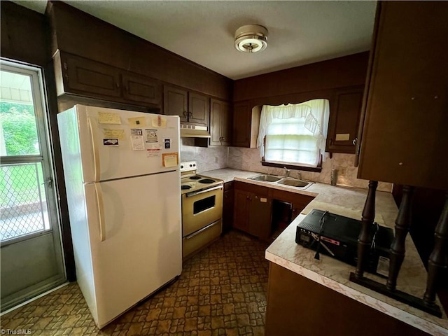 5261 Windemere Cir, Trinity, NC 27370 - kitchen with freestanding refrigerator, electric range oven, under cabinet range hood, light countertops, and tasteful backsplash