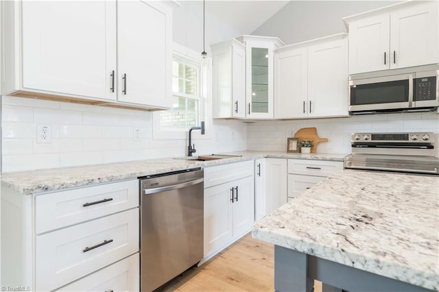 115 Corbin Ln, Lexington, NC 27295 - kitchen featuring stainless steel appliances, white cabinetry, glass insert cabinets, tasteful backsplash, and light stone countertops