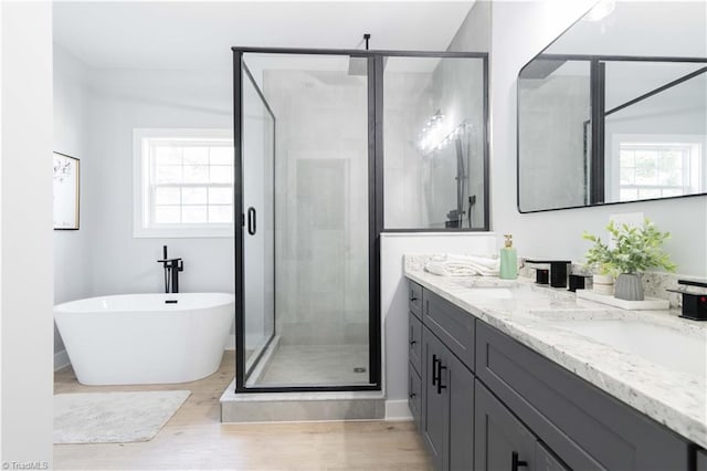 115 Corbin Ln, Lexington, NC 27295 - full bathroom with double vanity, a shower stall, wood finished floors, and a freestanding bath