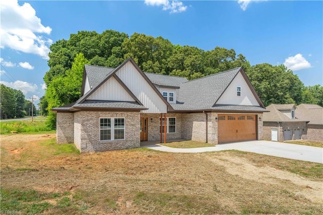 115 Corbin Ln, Lexington, NC 27295 - view of front of house featuring concrete driveway, an attached garage, a shingled roof, and brick siding