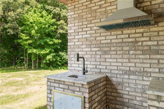 115 Corbin Ln, Lexington, NC 27295 - exterior view of range hood and brick siding