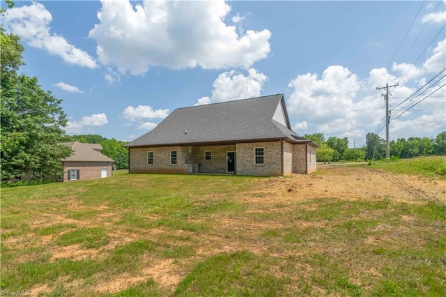 115 Corbin Ln, Lexington, NC 27295 - rear view of house featuring a yard and brick siding