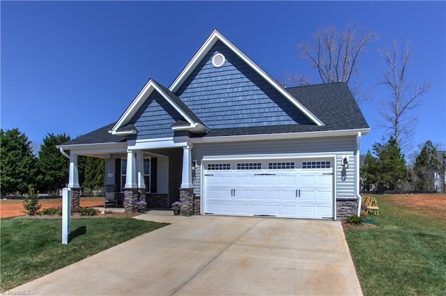 craftsman-style house featuring a porch, a garage, and a front yard