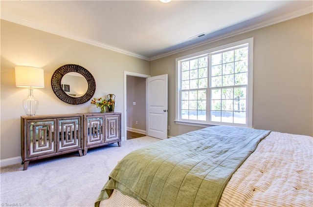 carpeted bedroom featuring crown molding