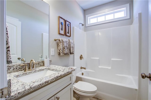 full bathroom featuring vanity, toilet, and bathtub / shower combination