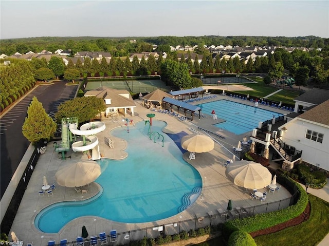 view of swimming pool featuring a patio area and a water slide